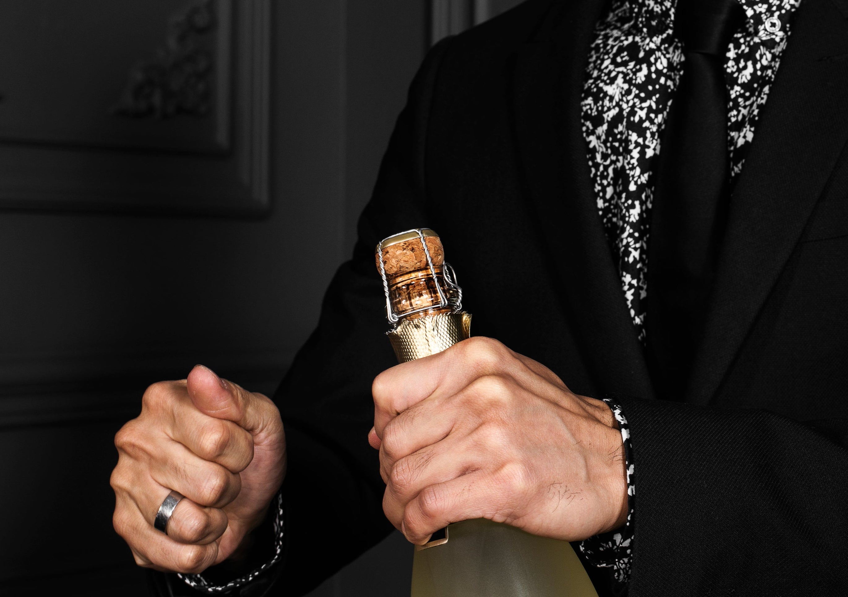 A happy Herbal Mojo for Guys customer celebrating with champagne