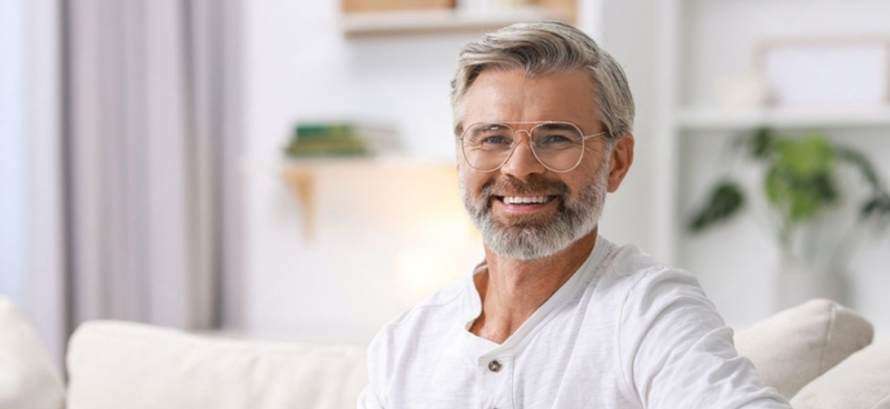 Man relaxed at home representing confident on-demand use of Herbal Mojo for Guys